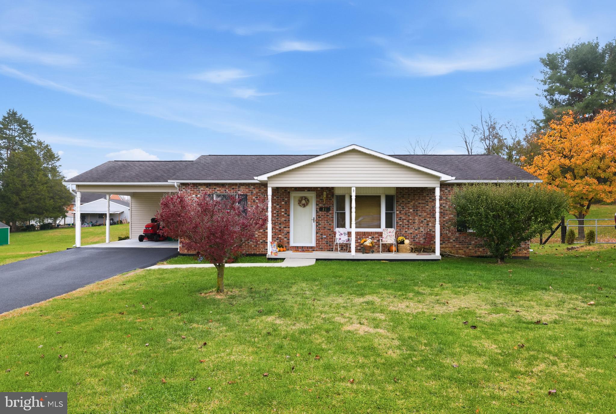 a front view of a house with a garden and porch