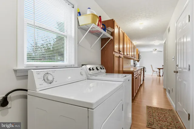 a front view of a house with a garden and porch