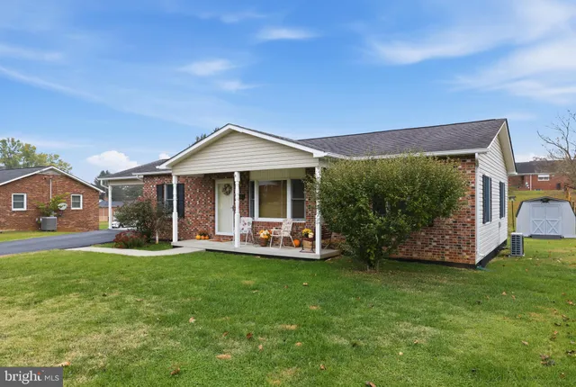 a view of a patio with table and chairs and potted plants