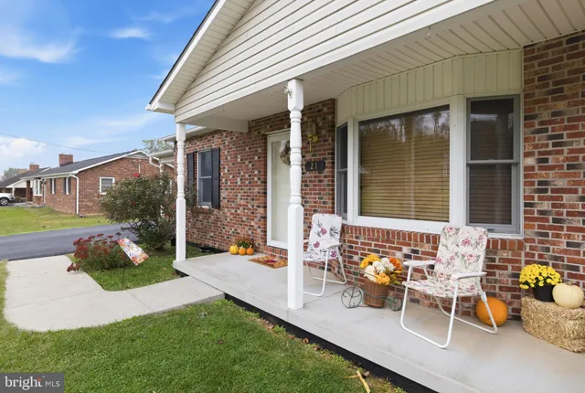 a view of a room with furniture and a window