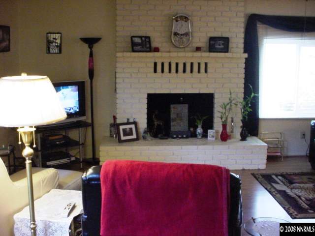 1445 Locksley Way Reno, NV 89503 - Photo 5 of 8 a living room with furniture and a fireplace