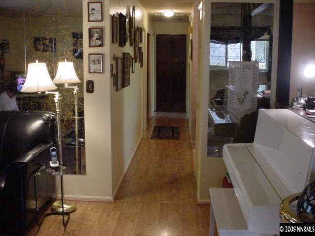 1445 Locksley Way Reno, NV 89503 - Photo 7 of 8 a living room with furniture and a floor to ceiling window