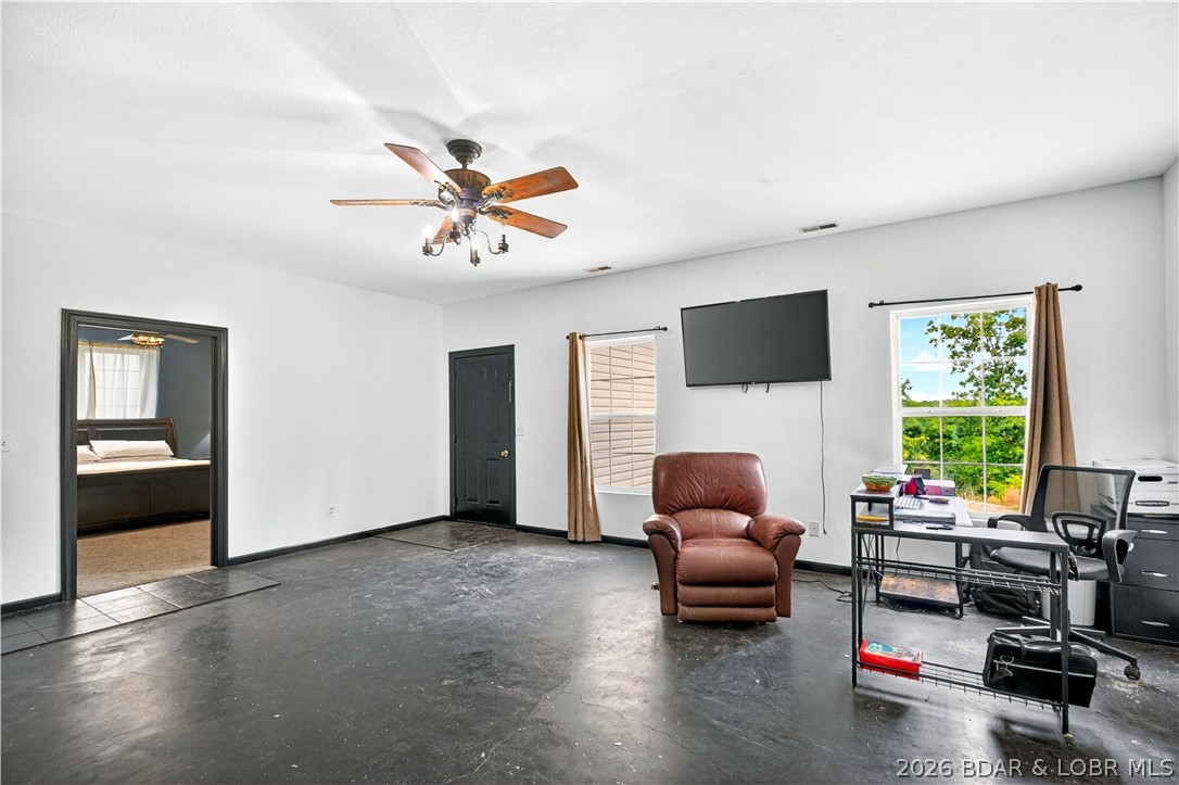 132 Hunters Ridge Road Camdenton, MO 65020 - Photo 24 of 44 Lower Level Family Room to Primary Suite & Garage