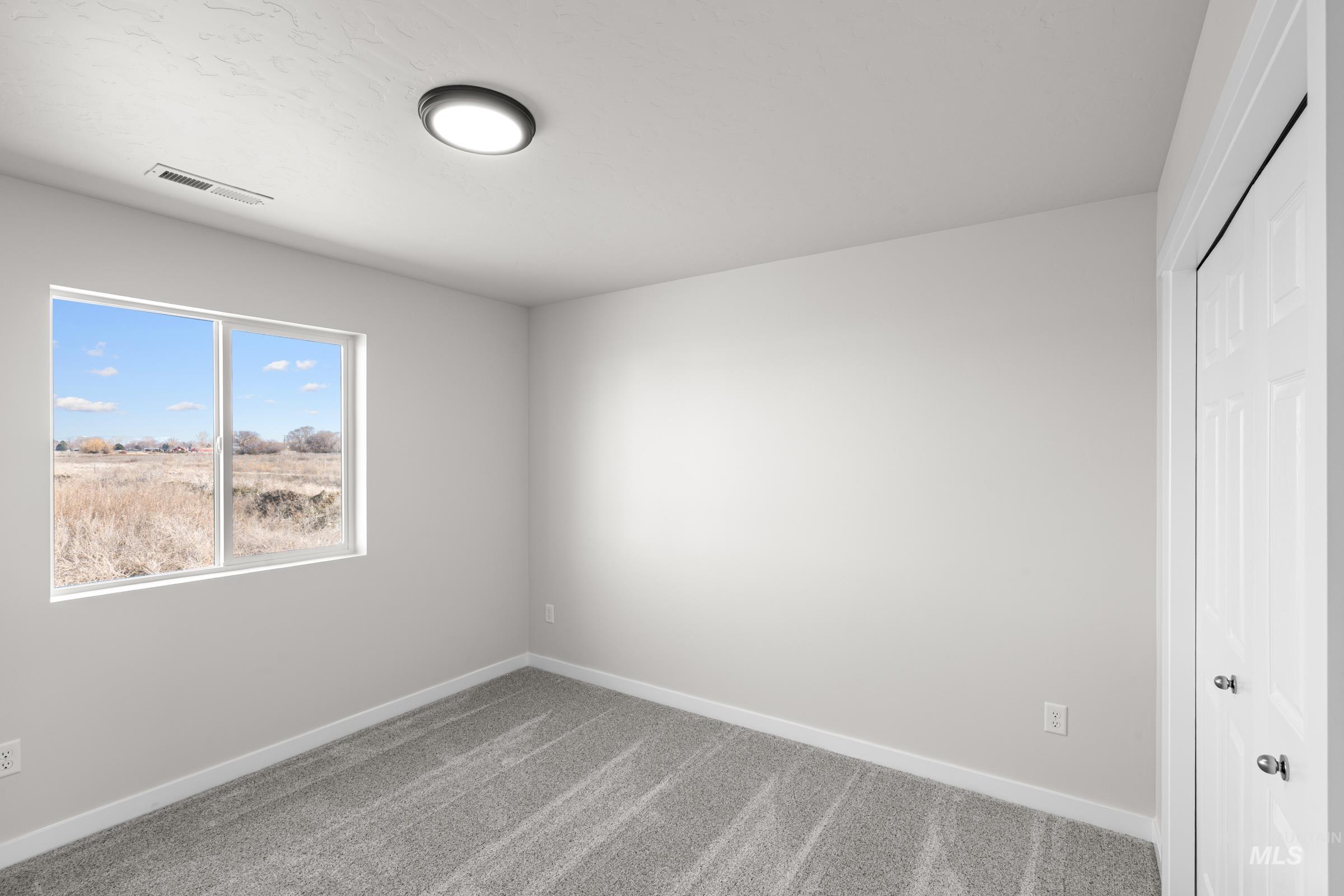1622 Covington Street Middleton, ID 83644 - Photo 10 of 19 Spare room featuring carpet floors and baseboards