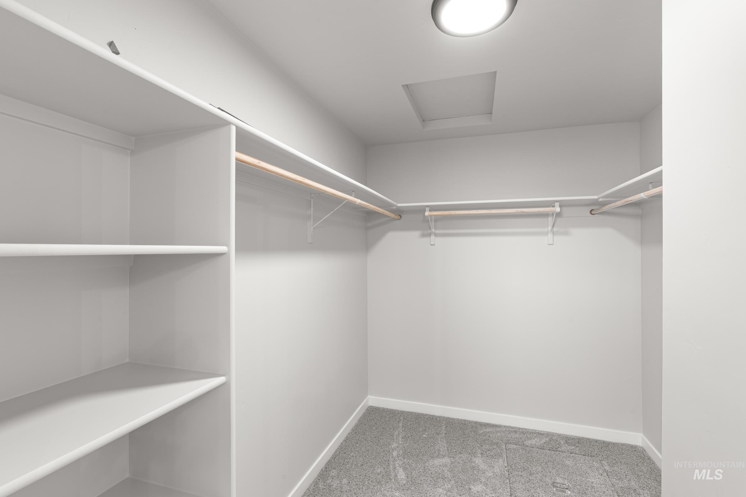 1622 Covington Street Middleton, ID 83644 - Photo 15 of 19 Walk in closet featuring attic access and light carpet