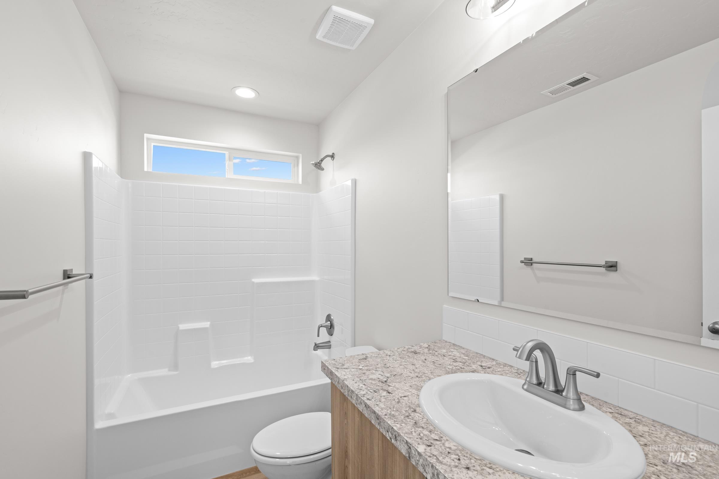 1622 Covington Street Middleton, ID 83644 - Photo 18 of 19 Bathroom featuring bathing tub / shower combination and vanity