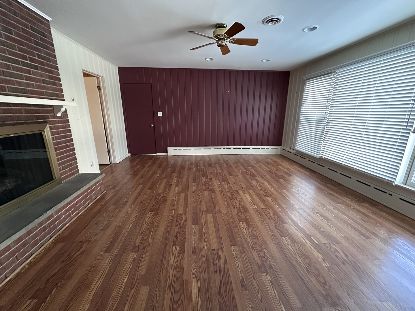 2300 Landwehr Road Northbrook, IL 60062 - Photo 15 of 28 a view of an empty room with wooden floor and a fireplace
