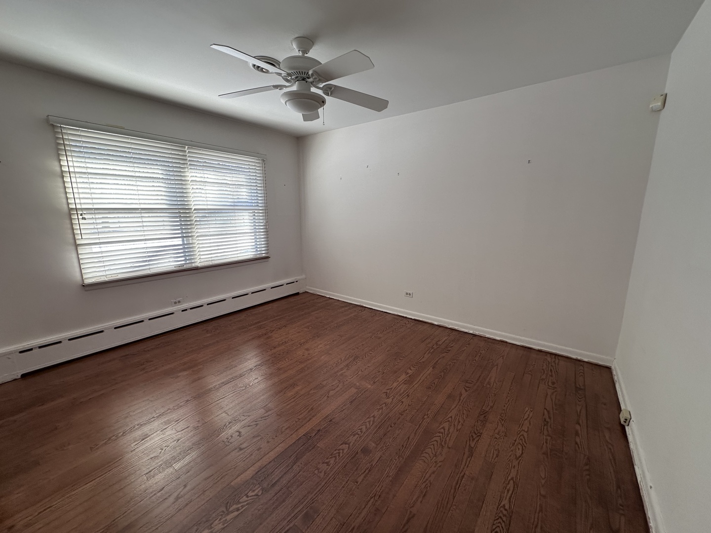 2300 Landwehr Road Northbrook, IL 60062 - Photo 17 of 28 an empty room with wooden floor and windows