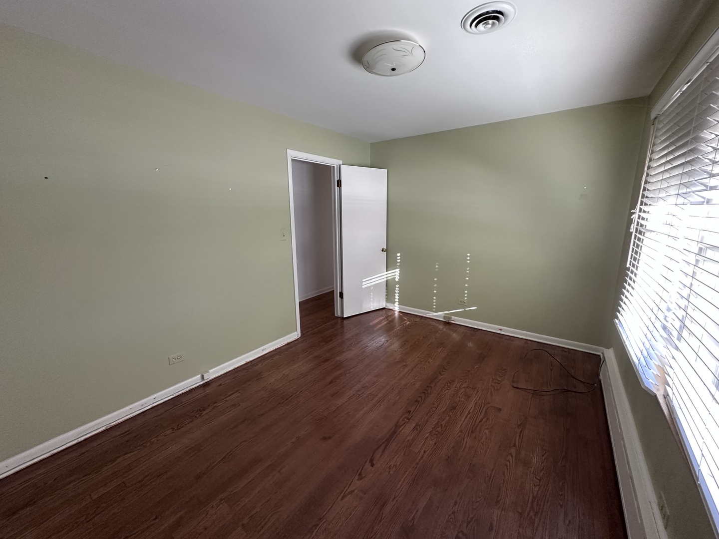 2300 Landwehr Road Northbrook, IL 60062 - Photo 20 of 28 an empty room with wooden floor and windows