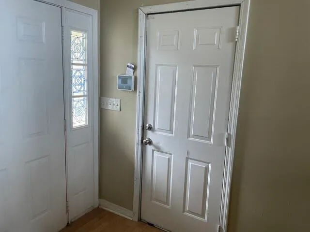 a view of an empty room and storage