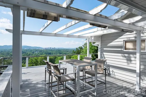 a view of a patio with a table chairs and a table
