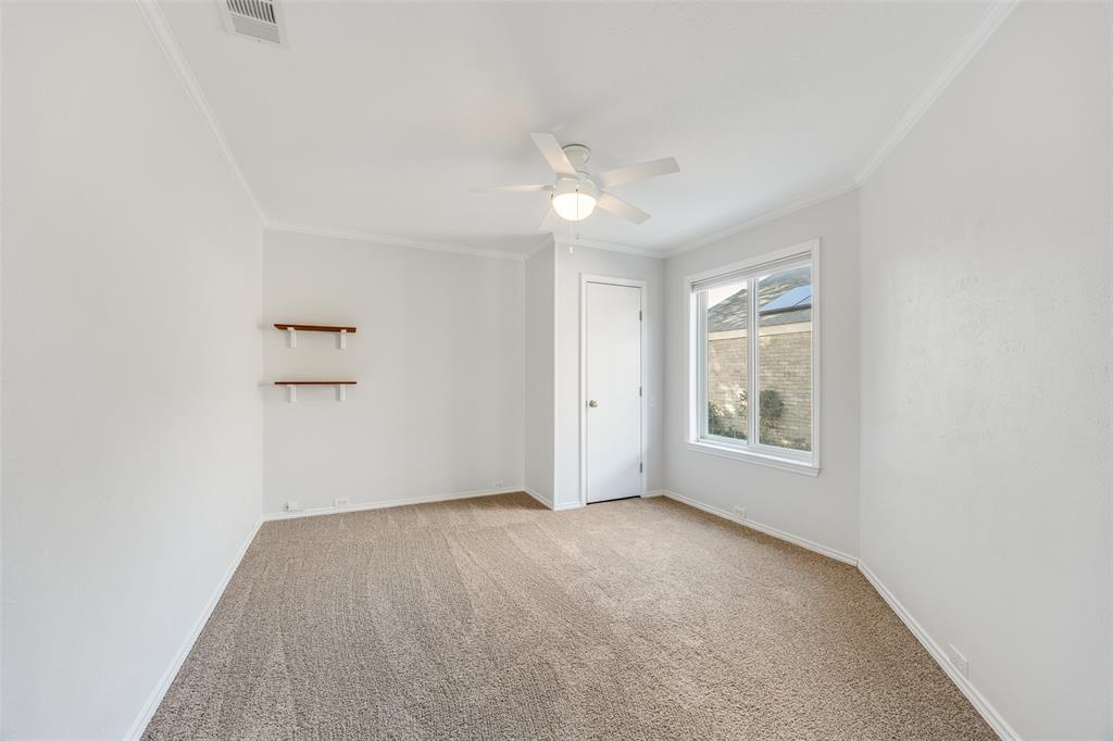 3919 Winter Park Lane Addison, TX 75001 - Photo 15 of 25 Unfurnished room with light carpet, a ceiling fan, and ornamental molding