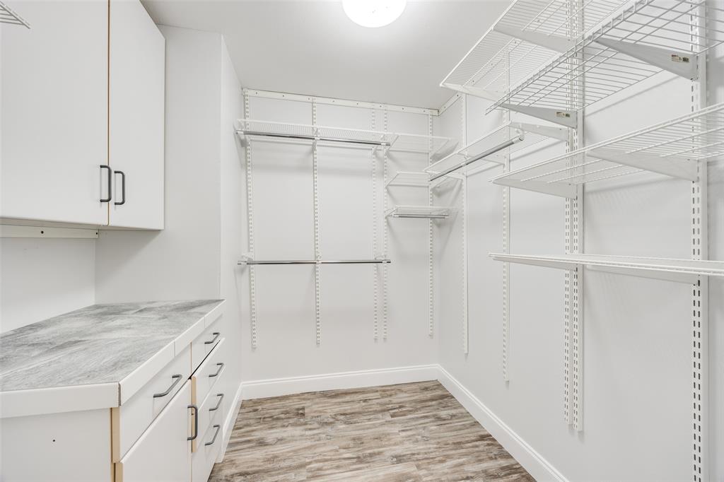 3919 Winter Park Lane Addison, TX 75001 - Photo 16 of 25 Walk in closet with light wood finished floors