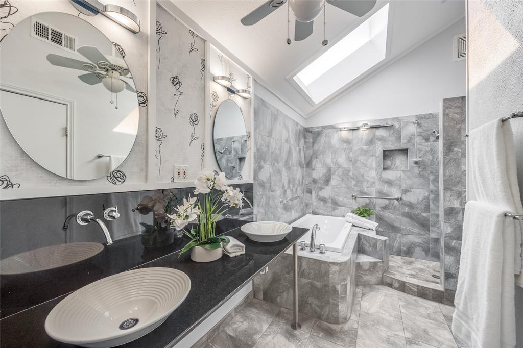 3919 Winter Park Lane Addison, TX 75001 - Photo 21 of 25 Bathroom with lofted ceiling, double vanity, ceiling fan, a garden tub, and walk in shower