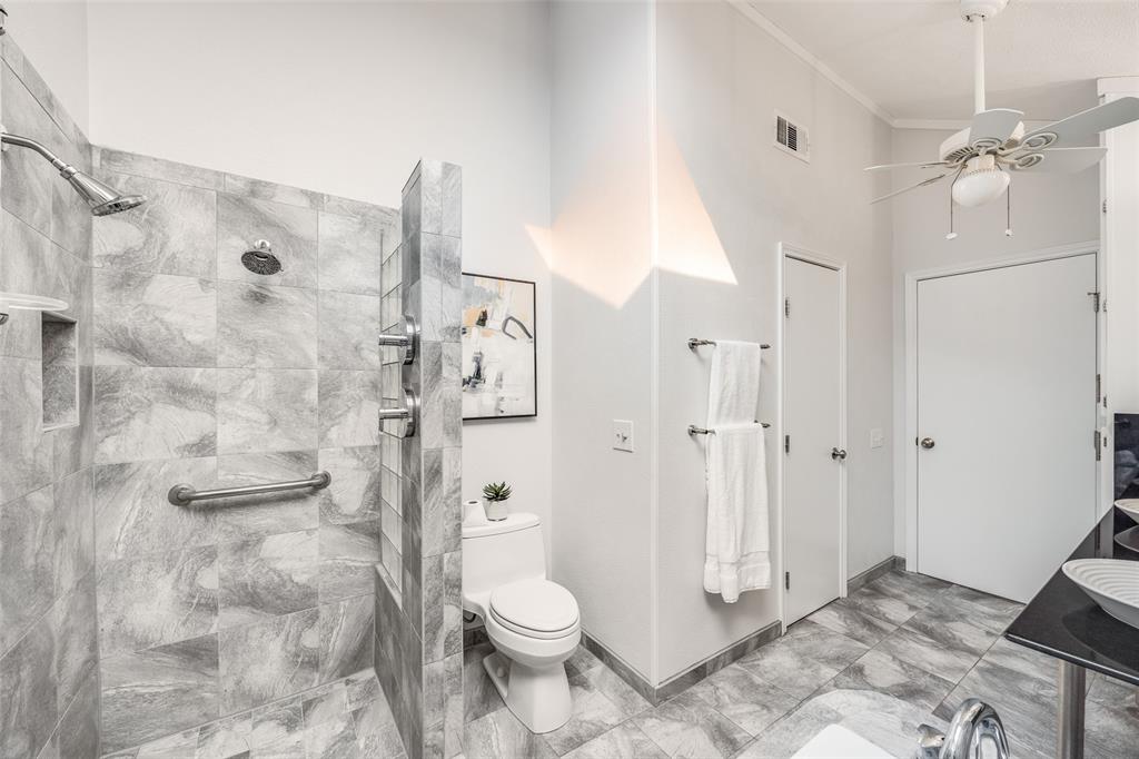 3919 Winter Park Lane Addison, TX 75001 - Photo 22 of 25 Bathroom featuring walk in shower, ceiling fan, vanity, and crown molding