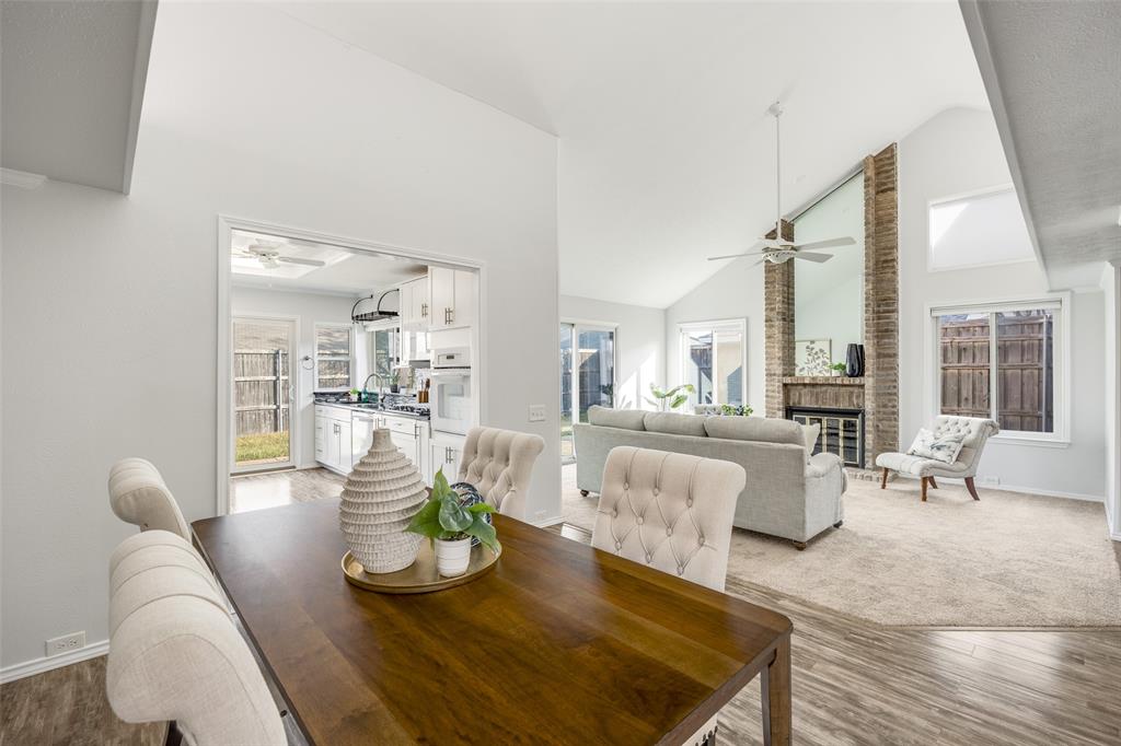 3919 Winter Park Lane Addison, TX 75001 - Photo 8 of 25 Dining space featuring ceiling fan, vaulted ceiling, light wood-style flooring, and plenty of natural light