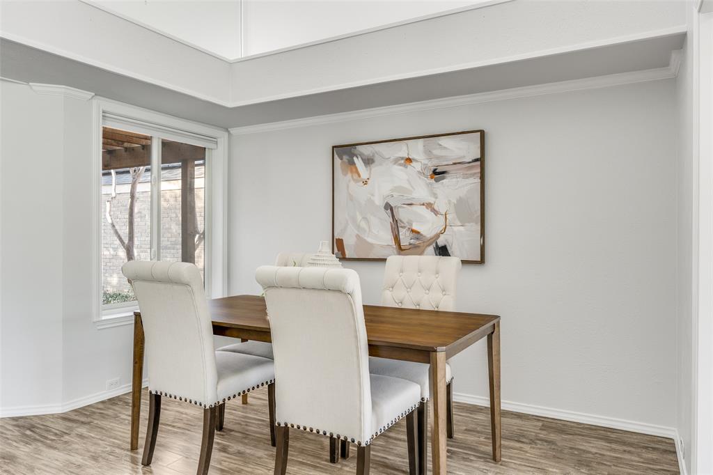 3919 Winter Park Lane Addison, TX 75001 - Photo 9 of 25 Dining area with wood finished floors and ornamental molding