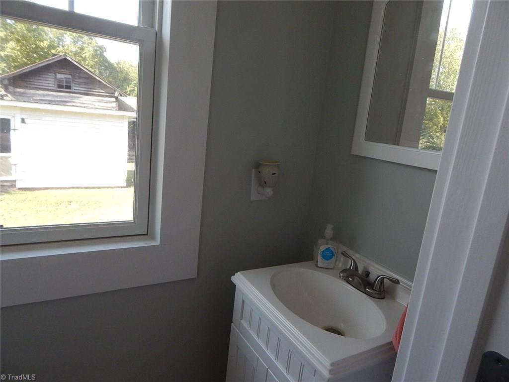 3990 Beasley School Road Sandy Ridge, NC 27046 - Photo 11 of 28 Half bath on main level.