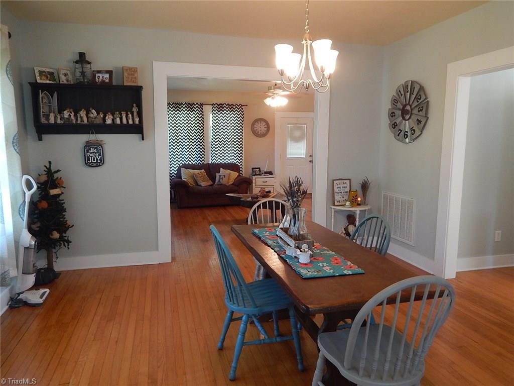 3990 Beasley School Road Sandy Ridge, NC 27046 - Photo 9 of 28 The dining area opens into living room for easy flow.