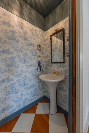 a bathroom with a sink and mirror