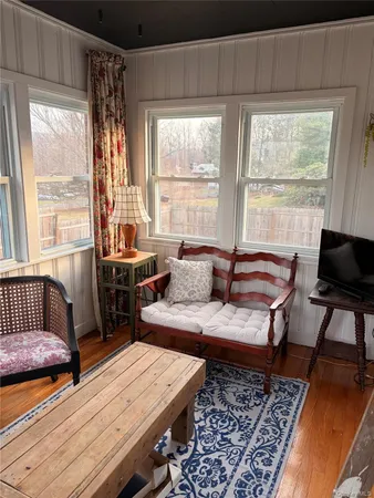 a living room with furniture and a window