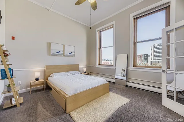 a bedroom with a bed and a cabinets