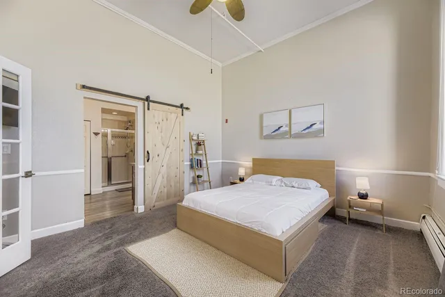 a bedroom with a bed a table and chair