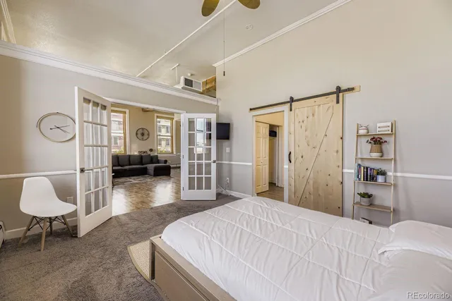 a bedroom with furniture and a window