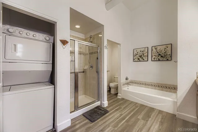 a spacious bathroom with a granite countertop sink and a mirror