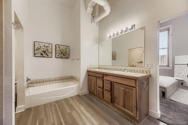 a bathroom with a bathtub and shower