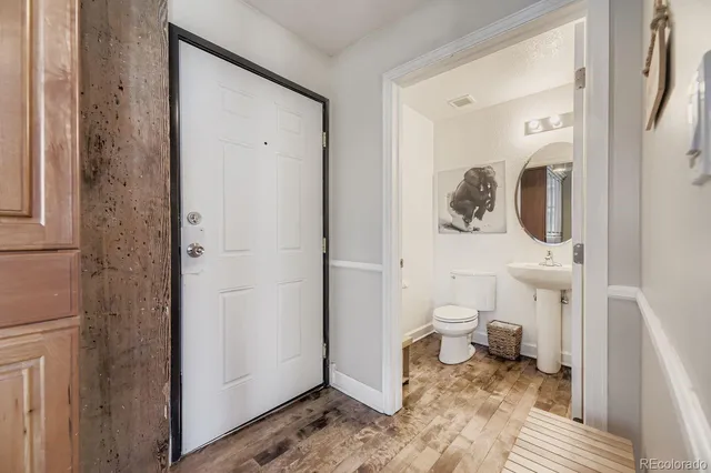 a living room with furniture wooden floor and window