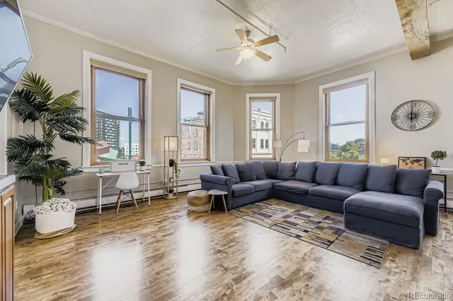 a living room with furniture window and a table