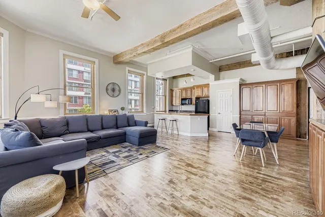 a view of a dining room with furniture and wooden floor