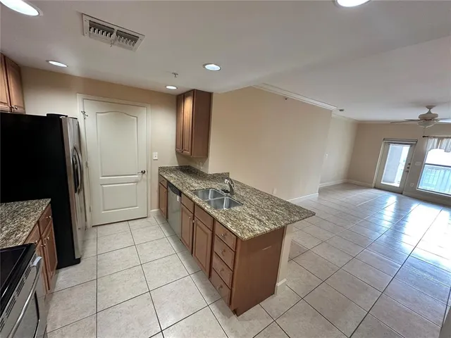 a view of an empty room and window wooden floor and fire place