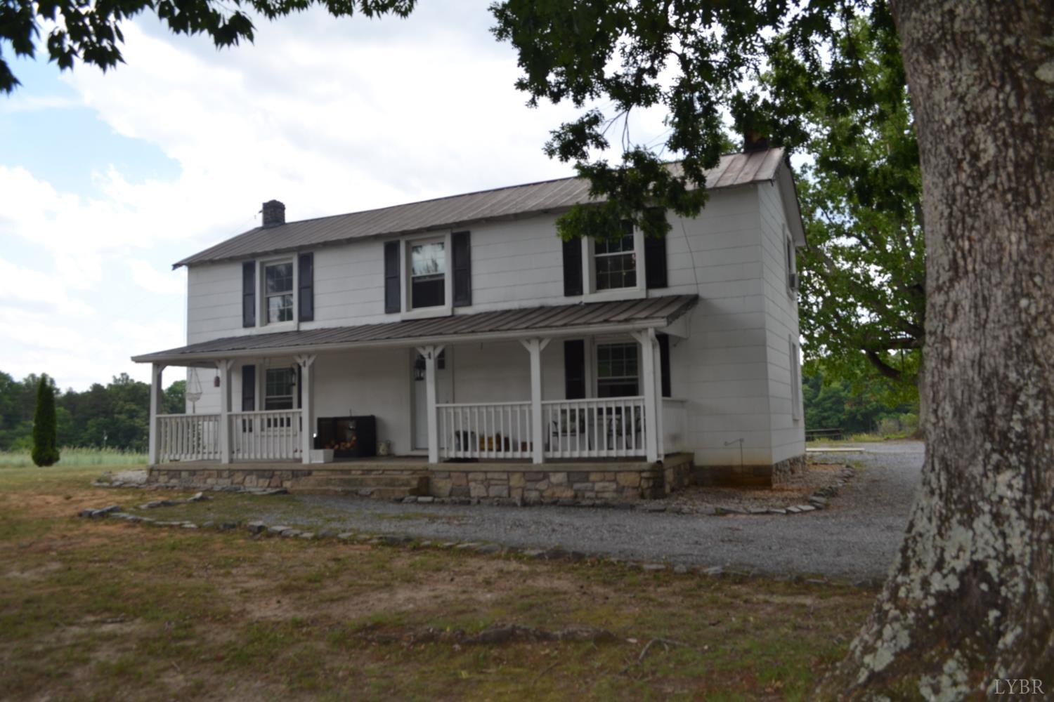6387 Red House Road Rustburg, VA 24588 - Photo 6 of 38 a front view of a house with a tree