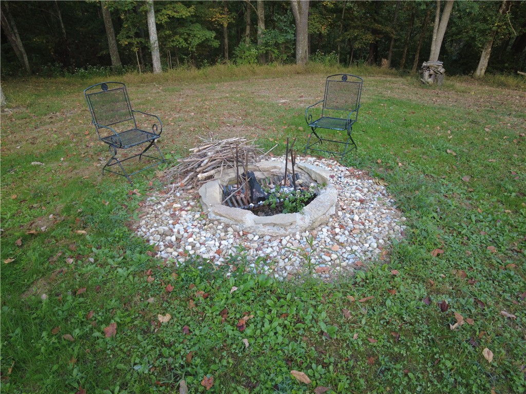 1147 Richey Road Felicity, OH 45120 - Photo 8 of 26 This serene outdoor space features a well-appointed fire pit, perfect for evening gatherings.