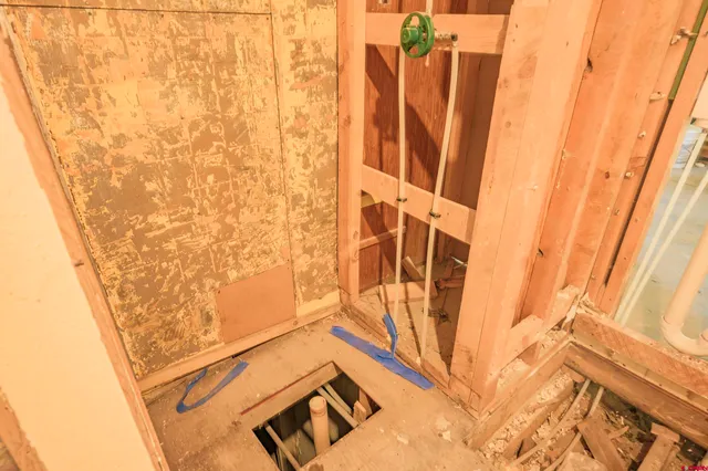 a view of room with window and wooden floor