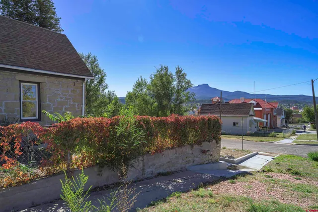 a view of a house with a street