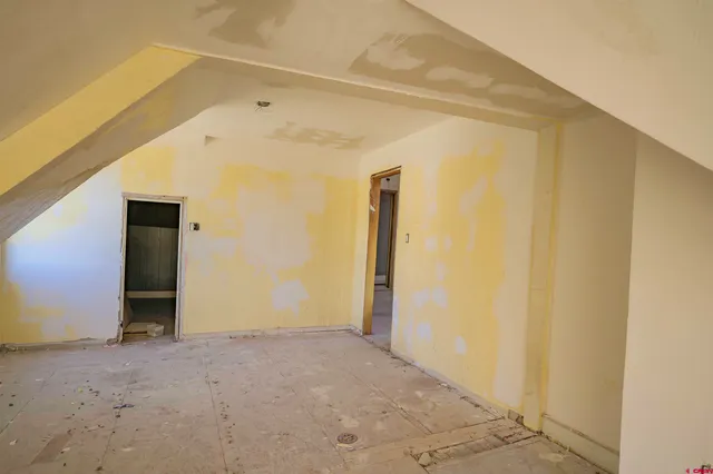 a view of a brick house with a yard