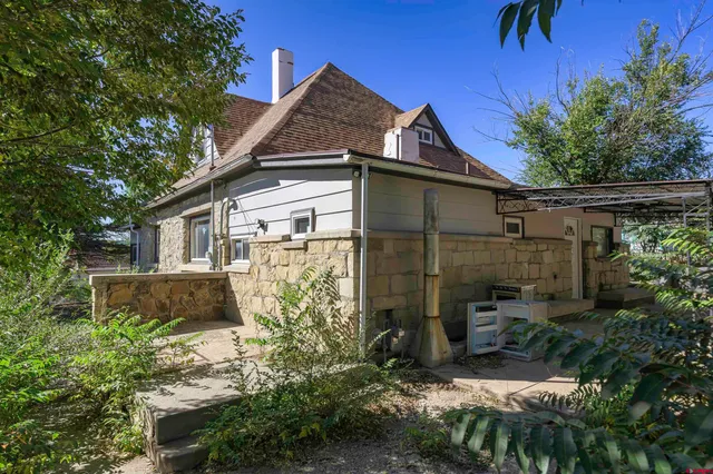 a view of a city with lots of potted plants