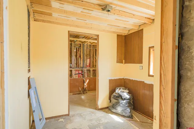 a view of a bathroom with a tub and shower