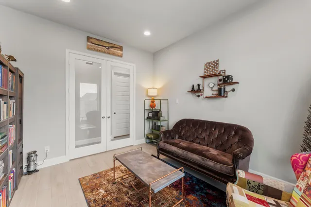 a bedroom with furniture and a chandelier