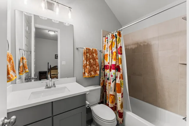 a view of a hallway with wooden cabinets and entryway