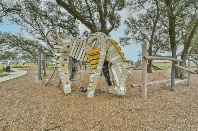 a view of a park with swings and slides