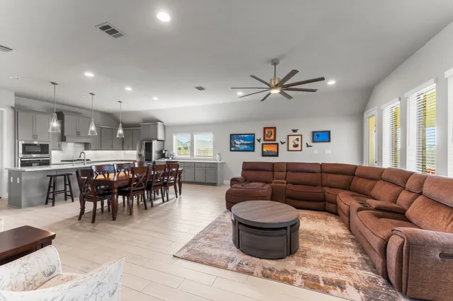 a living room with furniture and a fireplace