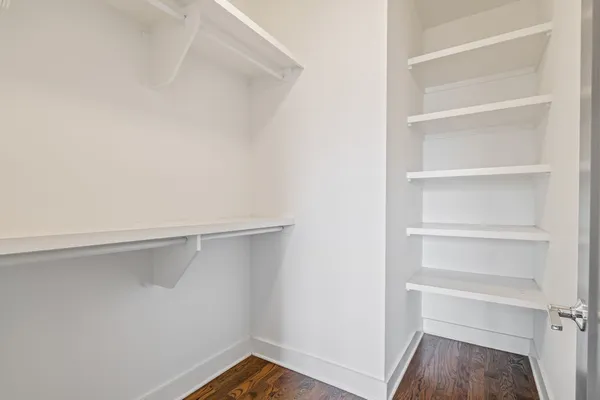 a view of an empty walk in closet