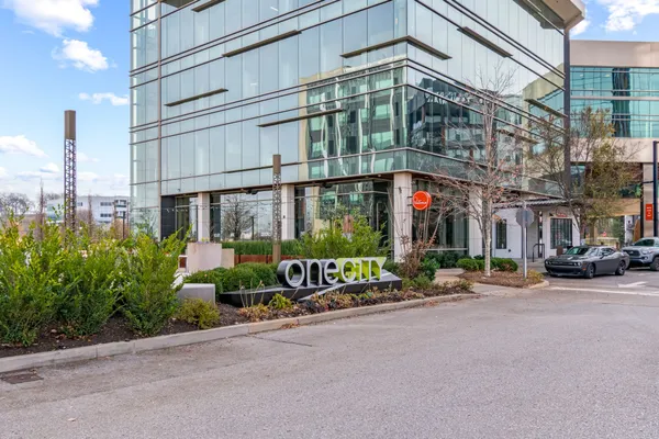 a building with sign broad in front of it