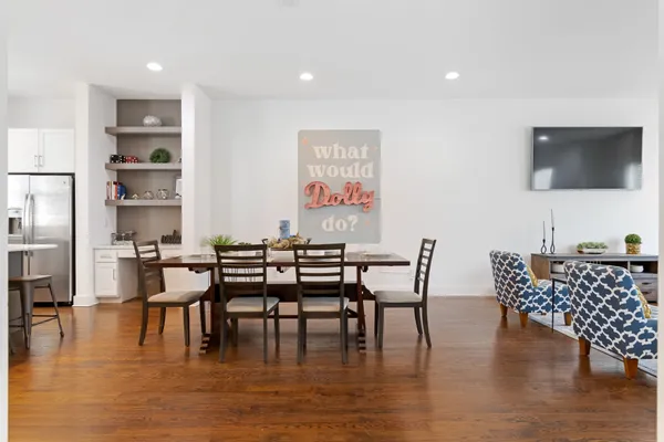 a dining room with furniture wooden floor and a rug