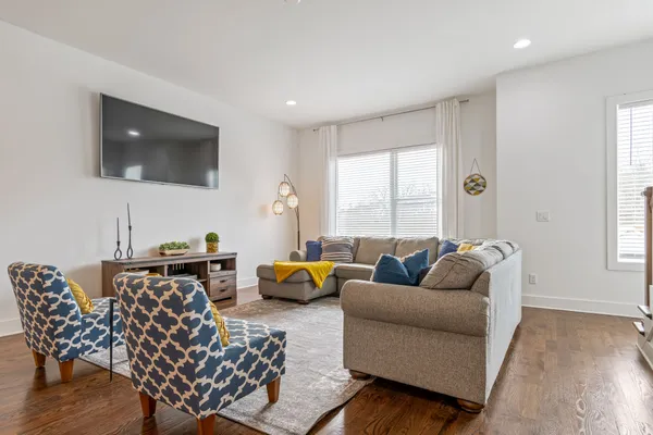 a living room with furniture and a flat screen tv