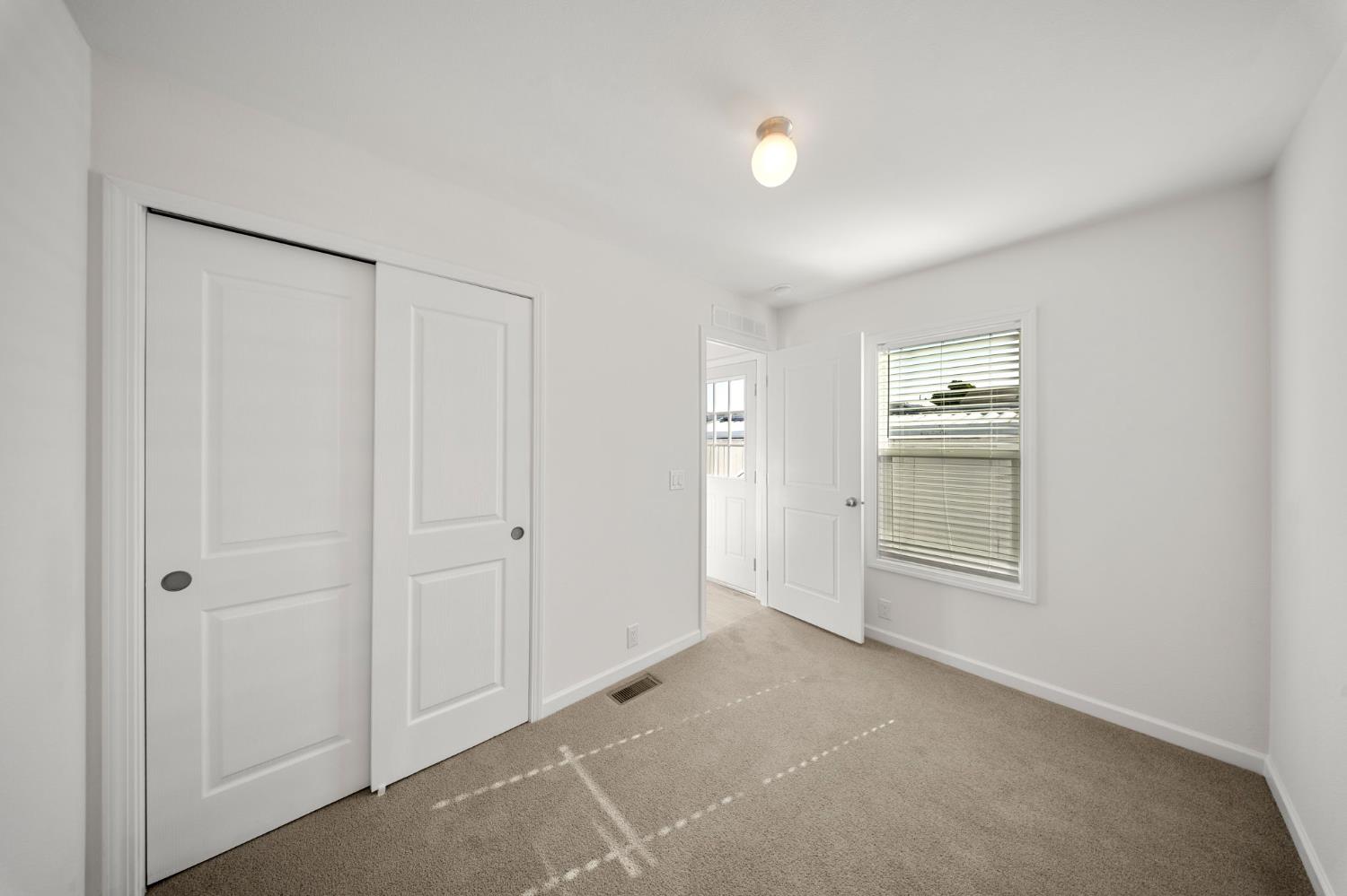 360 East Grant Line Road, Unit 19A Tracy, CA 95376 - Photo 12 of 19 a view of an empty room with a window